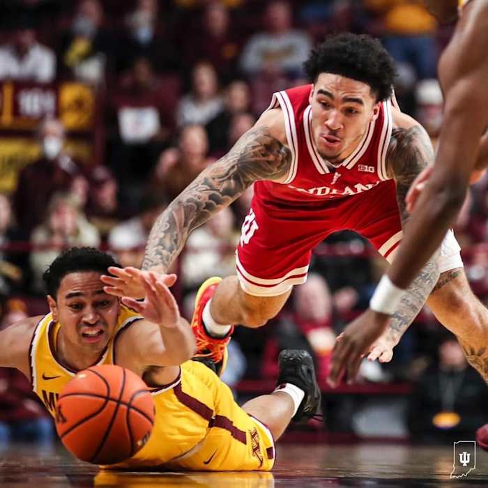 Indiana guard Jalen Hood-Schifino battles for a loose ball against the Minnesota Golden Gophers during Wednesday's game.