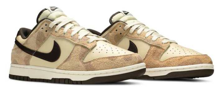 View of tan Nike Dunk shoes.