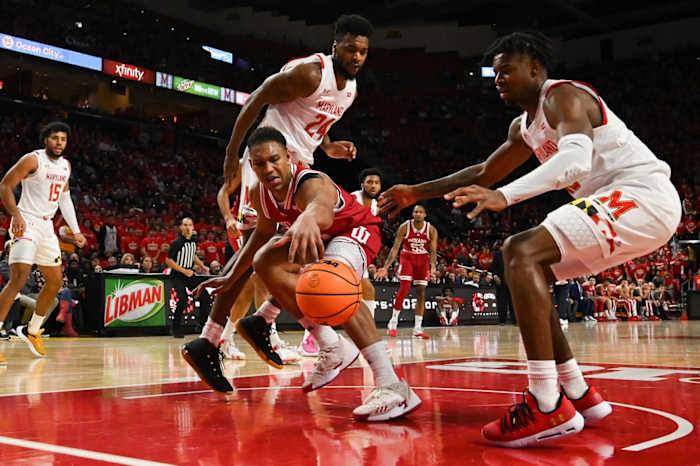 Indiana Hoosiers forward Malik Reneau (5) reaches for a loose ball as Maryland Terrapins Hakim Hart (13) and Donta Scott (24) defend during the first half at Xfinity Center.