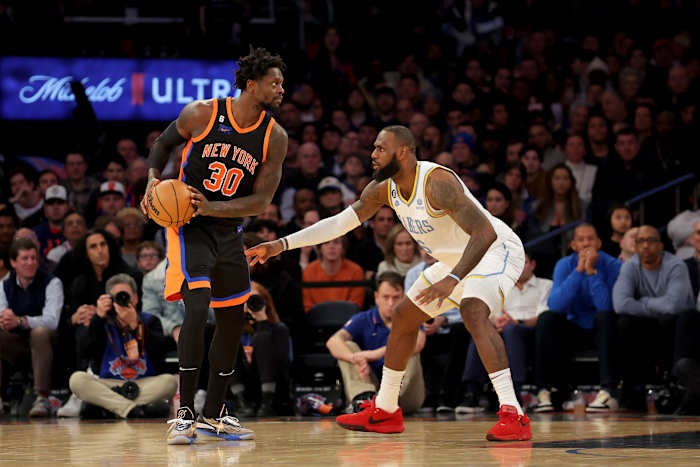 Lakers forward LeBron James defends Knicks forward Julius Randle.