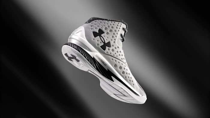 View of grey, black, and white Under Armour shoe.