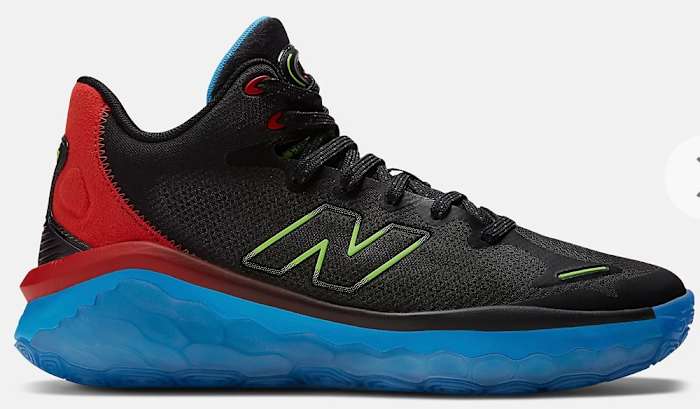 Side view of black, red, and blue New Balance shoe.