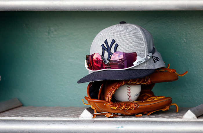 New York Yankees hat rests on glove in spring training