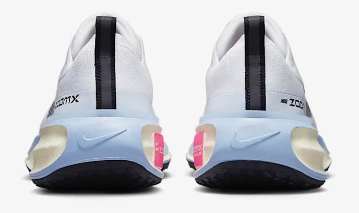 Rear view of white and blue Nike shoes.