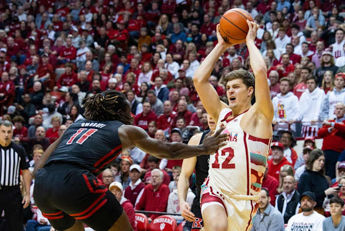 Indiana Hoosiers forward Miller Kopp (12) shoots the ball while Rutgers Scarlet Knights center Clifford Omoruyi (11) defends in the first half at Simon Skjodt Assembly Hall.