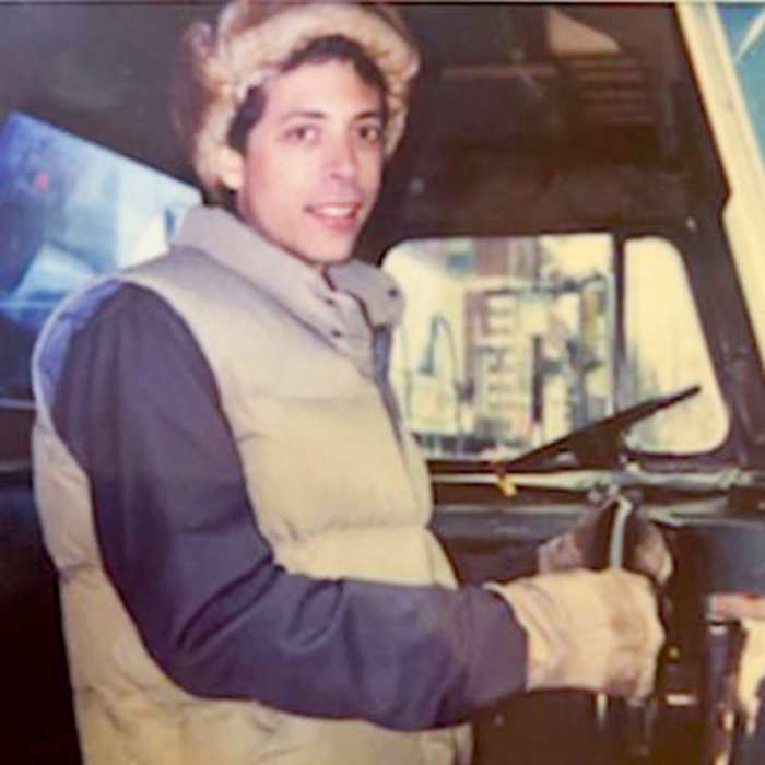 Fred Stoller in a garbage truck on set