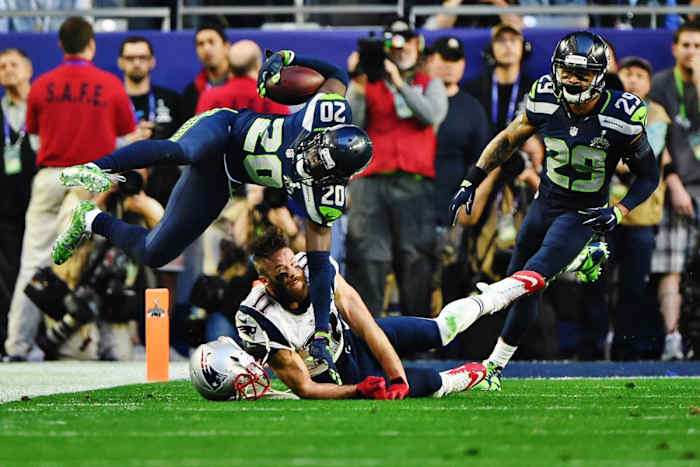 Jeremy Lane braces for the fall that broke his arm after an interception during Super Bowl 49
