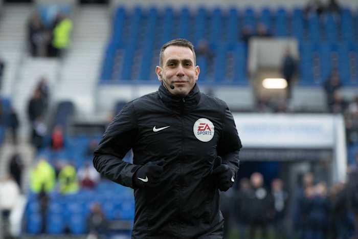 Coote warming up for an FA Cup clash between Brighton and Liverpool. 