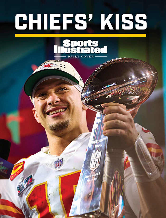 Patrick Mahomes smiles as he holds the Lombardi Trophy