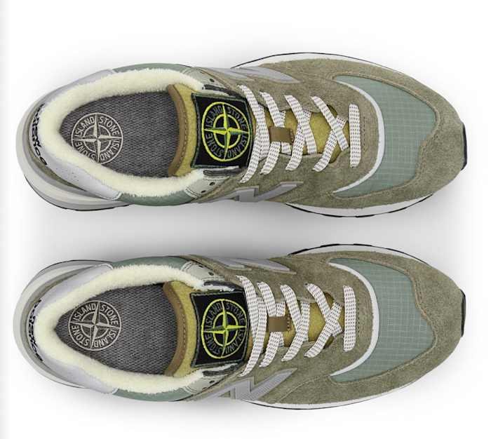 View of grey and white New Balance shoes.