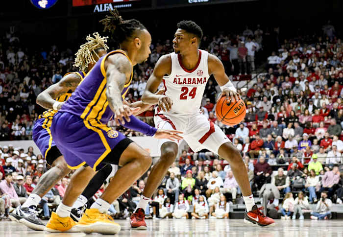 Alabama’s Brandon Miller dribbles