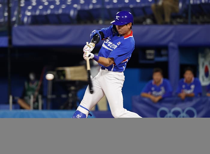 Team South Korea outfielder Jung Hoo Lee (51) hits a single against USA during the Tokyo 2020 Olympic Summer Games at Yokohama Baseball Stadium.
