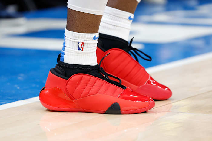 View of red and black Adidas shoes.