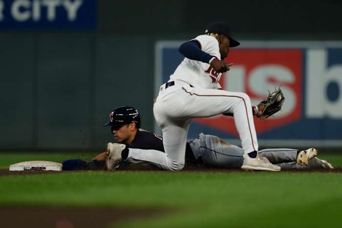 Sep 10, 2022; Minneapolis, Minnesota, USA; Cleveland Guardians left fielder Steven Kwan (38) steals second base ahead of the tag by Minnesota Twins second baseman Nick Gordon (1) in the fourth inning at Target Field. Mandatory Credit: Bruce Kluckhohn-USA TODAY Sports