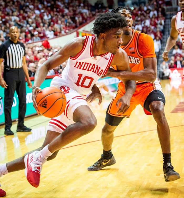 Indiana's Kaleb Banks (10) drives past Illinois' Sencire Harris (1) during the first half of the Indiana versus Illinois.