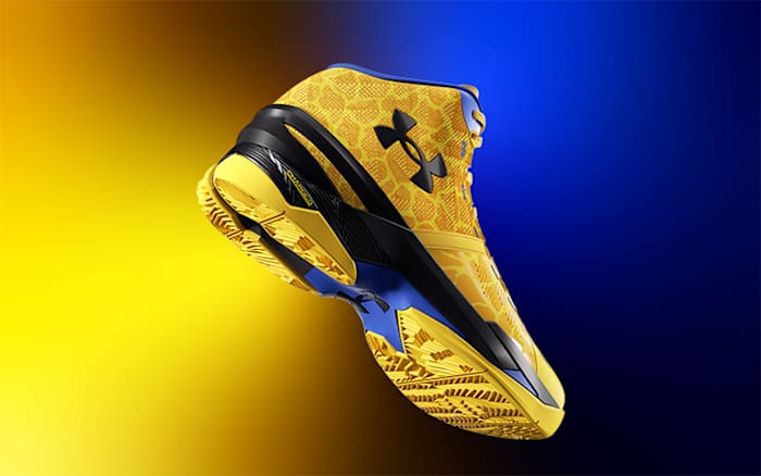 View of yellow and black Under Armour shoe.