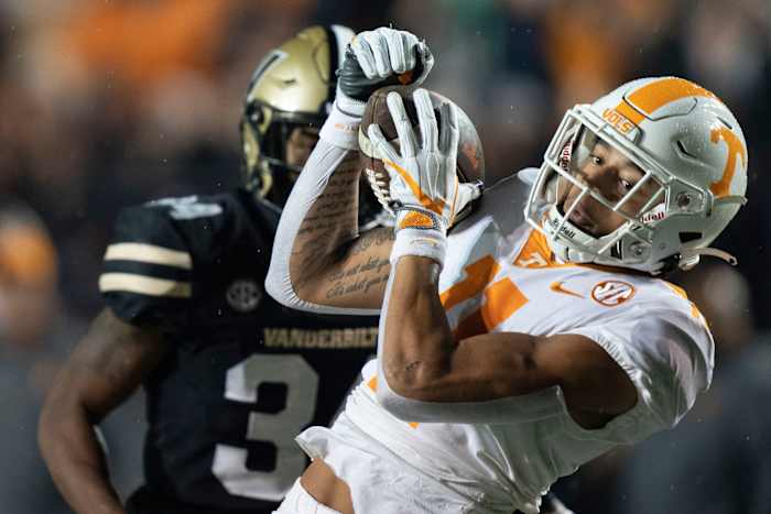 Tennessee wide receiver Jalin Hyatt (11) pulls in a first down catch Vanderbilt defensive back Ja'Dais Richard (34) during the first quarter at FirstBank Stadium Saturday, Nov. 26, 2022, in Nashville, Tenn.
