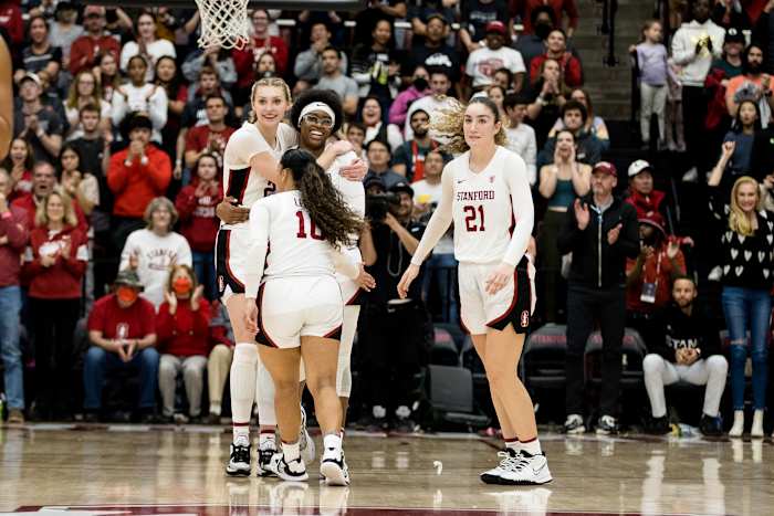 Stanford, California, USA; Stanford Cardinal forward Francesca Belibi (5) and guard Haley Jones (30) and forward Cameron Brink (22) and forward Brooke Demetre (21) celebrate their 71-66 victory over UCLA Bruins at Maples Pavilion.