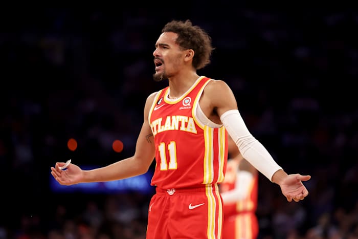 Hawks guard Trae Young questions a foul call.