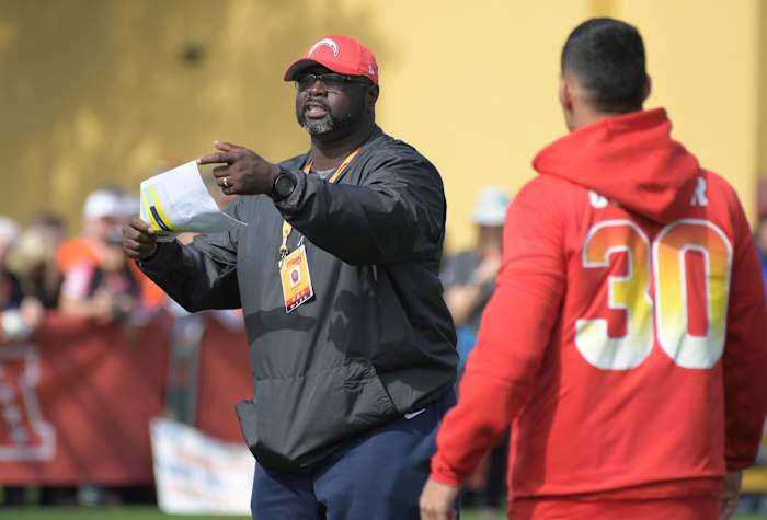 Jan 24, 2019; Kissimmee, FL, USA; Los Angeles Chargers assistant special teams coach Keith Burns (left) talks with Pittsburgh Steelers running back James Conner (30) during AFC practice for the 2019 Pro Bowl at ESPN Wide World of Sports Complex.