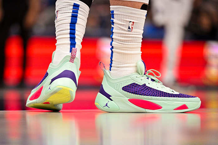 View of Luka Doncic's green and purple Jordan shoes.