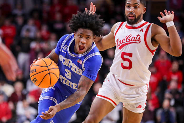 Jan 22, 2023; Cincinnati, Ohio, USA; Memphis Tigers guard Kendric Davis (3) dribbles past Cincinnati Bearcats guard David DeJulius (5) the second half at Fifth Third Arena. Mandatory Credit: Katie Stratman-USA TODAY Sports