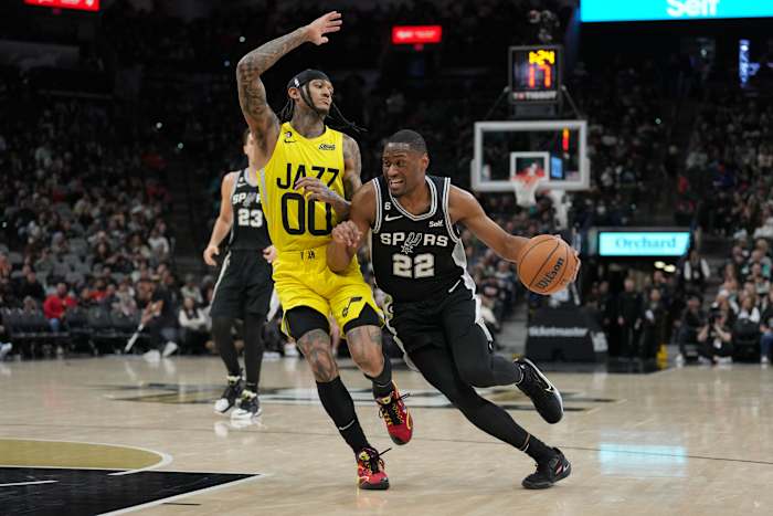 Branham shoves his way to the basket against Jordan Clarkson. 