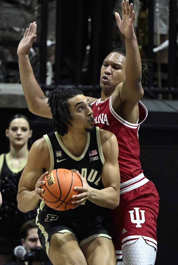 Purdue Boilermakers forward Trey Kaufman-Renn (4) controls the ball against Indiana Hoosiers forward Malik Reneau (5).