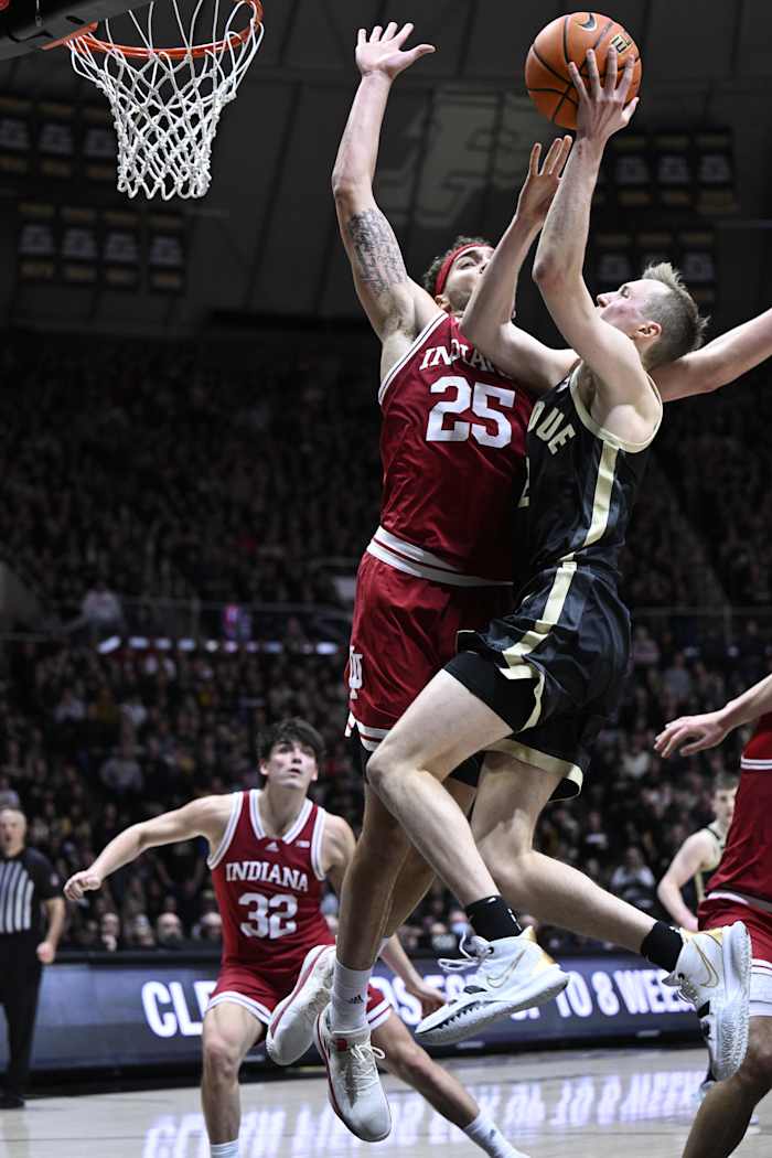 Race Thompson (25) blocks a shot by Purdue Boilermakers guard Fletcher Loyer (2) during the second half at Mackey Arena.