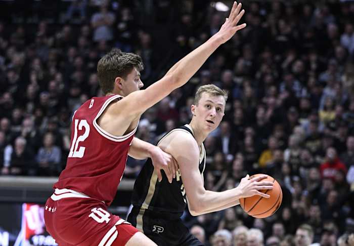 Purdue Boilermakers guard Fletcher Loyer (2) controls the ball against Indiana Hoosiers forward Miller Kopp (12).