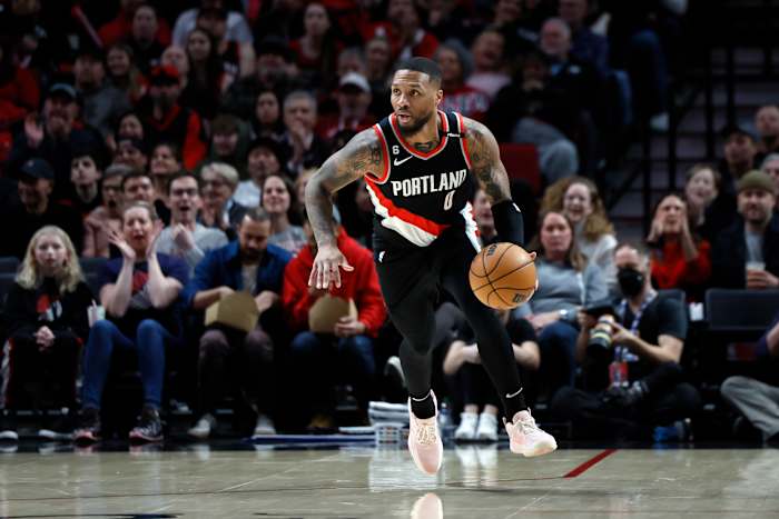 Portland Trail Blazers guard Damian Lillard dribbles the ball.