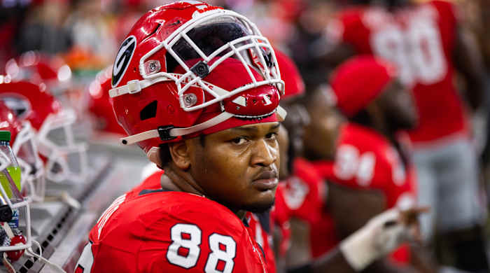 Georgia defensive lineman Jalen Carter sits on the sideline bench