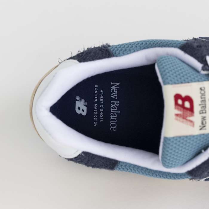 View of blue and white New Balance shoe insole.