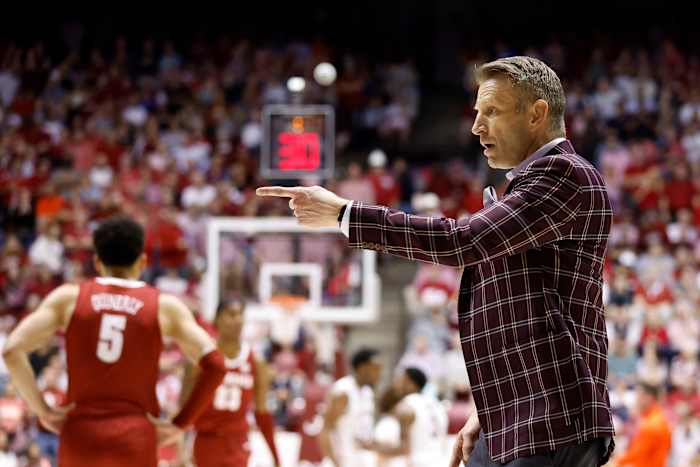 Alabama Crimson Tide head coach Nate Oats reacts to a call against the Auburn Tigers during the first half of an NCAA basketball game at Coleman Coliseum.