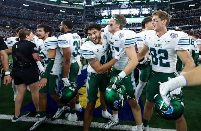 Jan 2, 2023; Arlington, Texas, USA; Tulane Green Wave players celebrate after the victory against the USC Trojans in the 2023 Cotton Bowl at AT&T Stadium.
