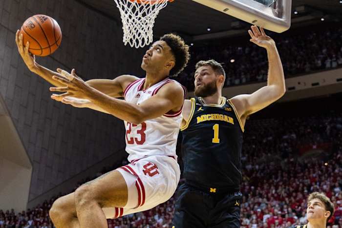 Indiana Hoosiers forward Trayce Jackson-Davis (23) shoots the ball while Michigan Wolverines center Hunter Dickinson (1) defends in the first half at Simon Skjodt Assembly Hall.