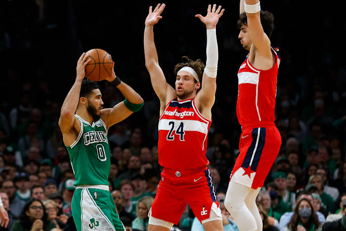 Boston Celtics forward Jayson Tatum looks for an opening around Washington Wizards forward Corey Kispert and Deni Avdija