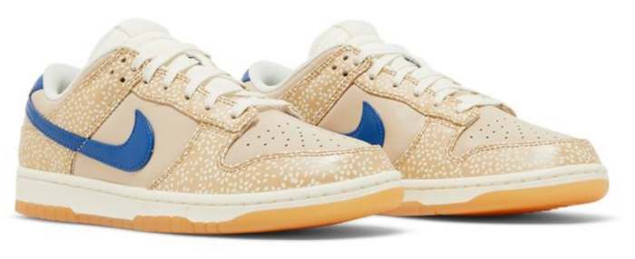 View of tan and blue Nike Dunk shoes.