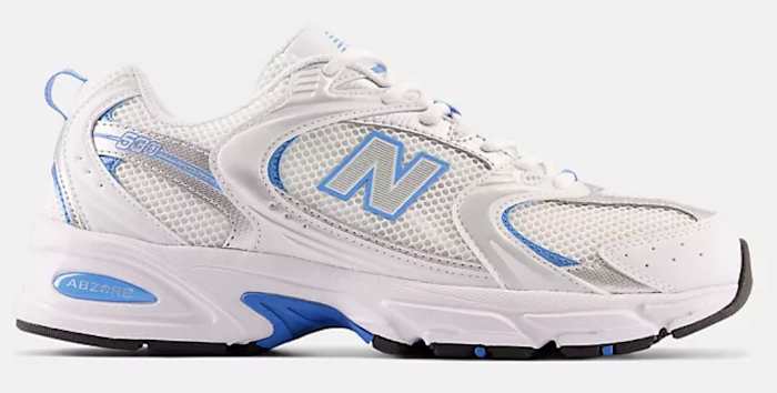 View of white and blue New Balance shoes.