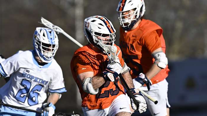 Petey LaSalla wins a faceoff during the Virginia men's lacrosse game against Johns Hopkins at Homewood Field in Baltimore, Maryland.