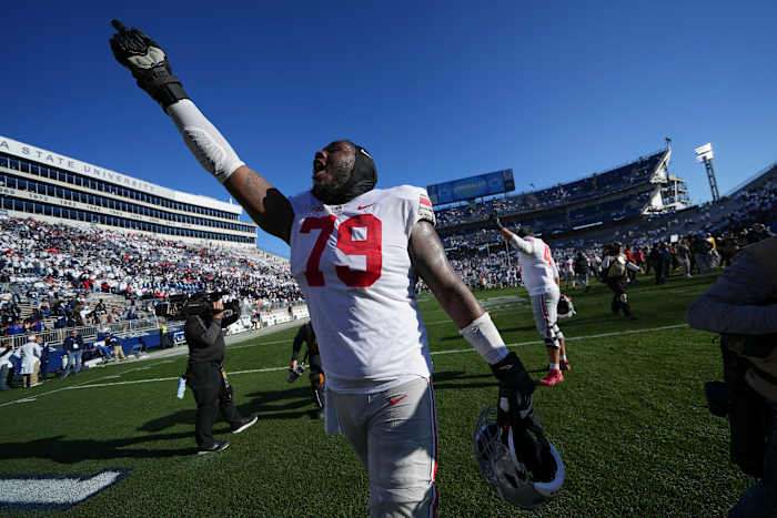 Oct 29, 2022; University Park, Pennsylvania, USA; Ohio State Buckeyes offensive linemen Dawand Jones (79) waves to the fans following the NCAA Division I football game against the Penn State Nittany Lions at Beaver Stadium. Ohio State won 41-33. Mandatory Credit: Adam Cairns-The Columbus Dispatch Ncaa Football Ohio State Buckeyes At Penn State Nittany Lions