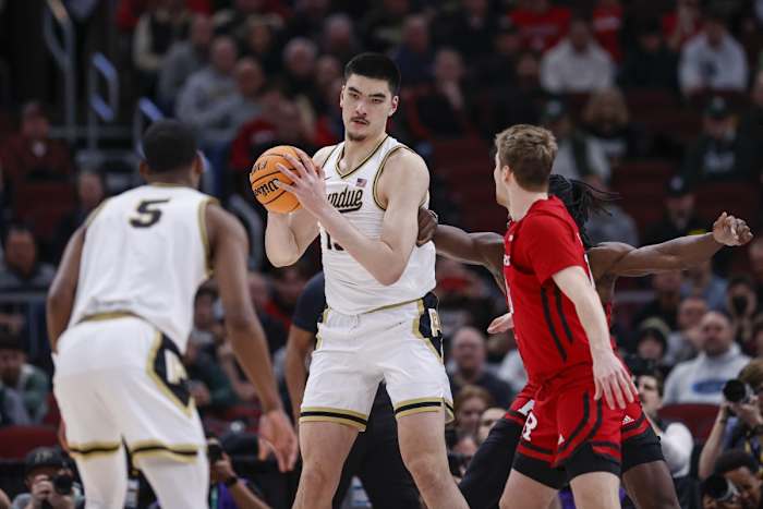 Zach Edey (15) looks to pass the ball away from Rutgers Scarlet Knights center Clifford Omoruyi (11) during the first half at United Center.