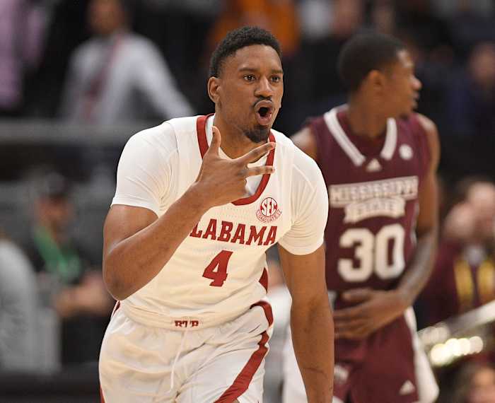 Alabama Crimson Tide forward Noah Gurley (4) celebrates a three point basket against the Mississippi State Bulldogs during the first half at Bridgestone Arena.