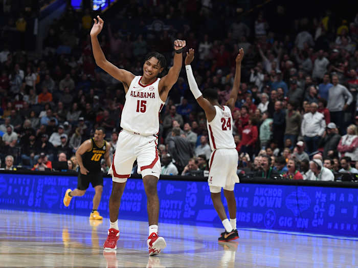 Alabama Crimson Tide forwards Noah Clowney (15) and Brandon Miller (24) celebrate after a basket during the second half against the Missouri Tigers at Bridgestone Arena.