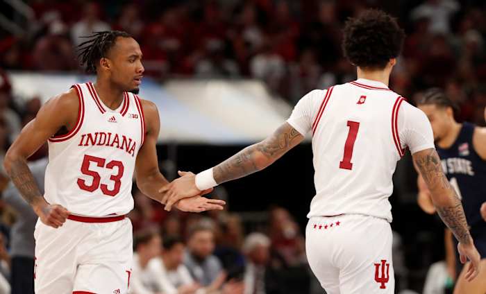 Tamar Bates (53) and guard Jalen Hood-Schifino (1) high-five during the Big Ten Men s Basketball Tournament semifinal game against the Penn State Nittany Lions,