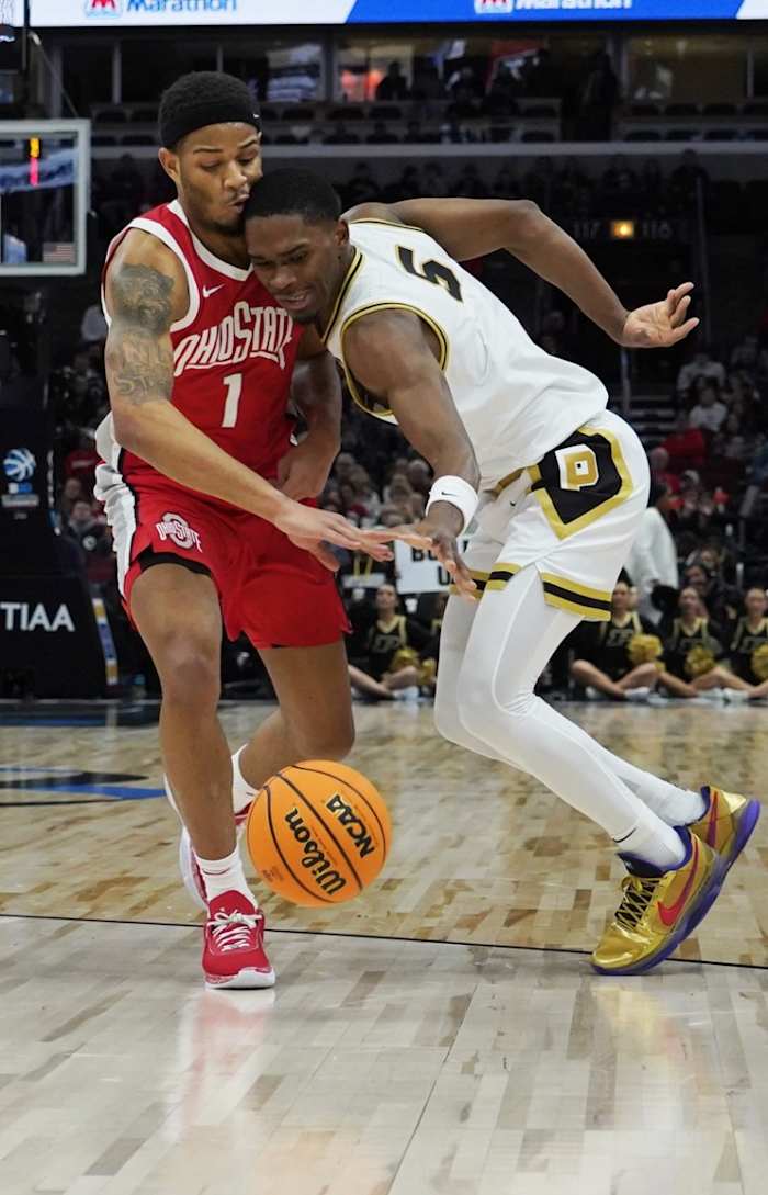Buckeyes guard Roddy Gayle Jr. (1) and Purdue Boilermakers guard Brandon Newman (5) go for the ball during the first half at United Center.