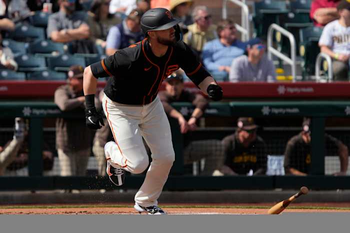 SF Giants right fielder Mitch Haniger (17) hits against the San Diego Padres in the first inning at Scottsdale Stadium. (2023)