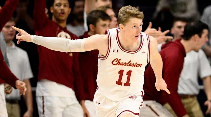 Charleston guard Ryan Larson celebrates a score