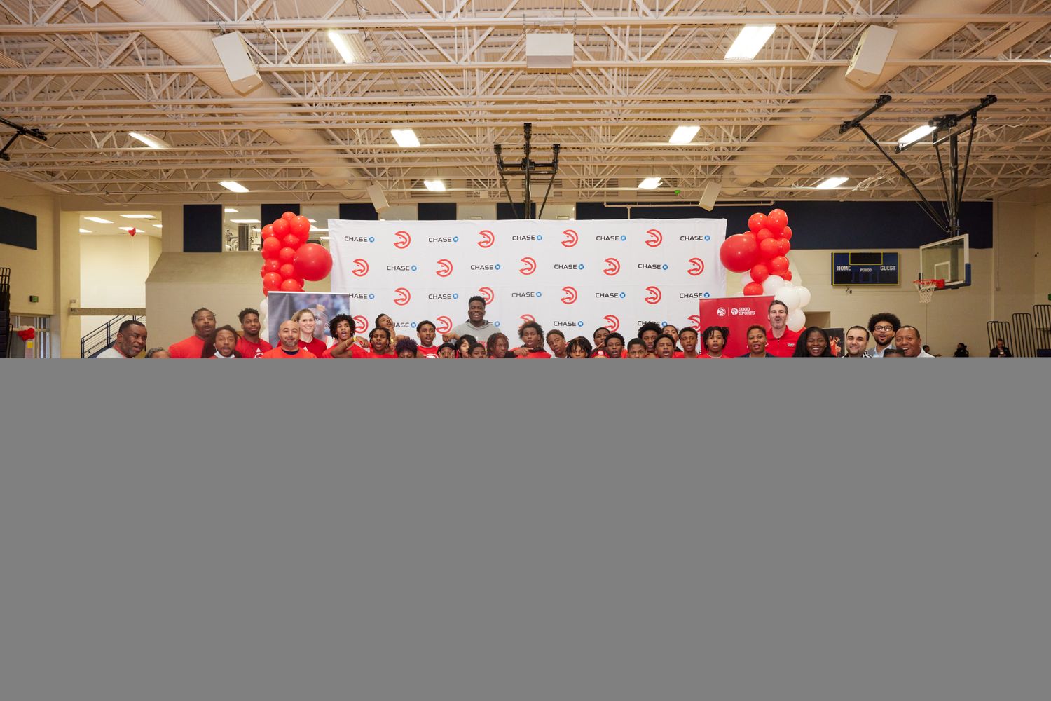 Kids pose at Atlanta Hawks basketball camp.