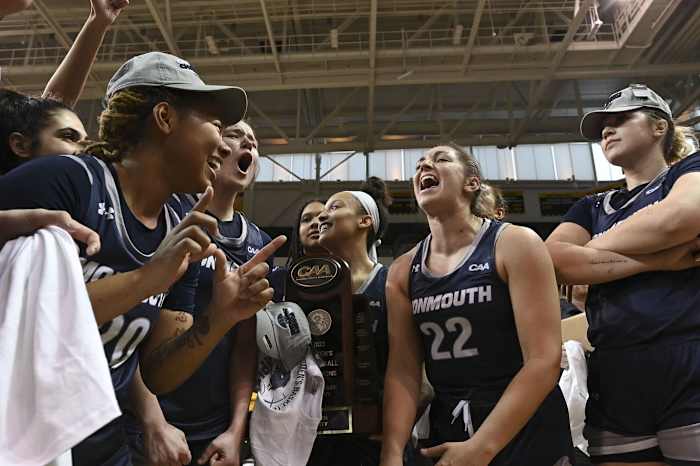 Mar 12, 2023; Towson, MD, USA; Monmouth Hawks celebrate on the court after defeating the Towson Tigers in the CAA Tournament Championship at SECU Arena.